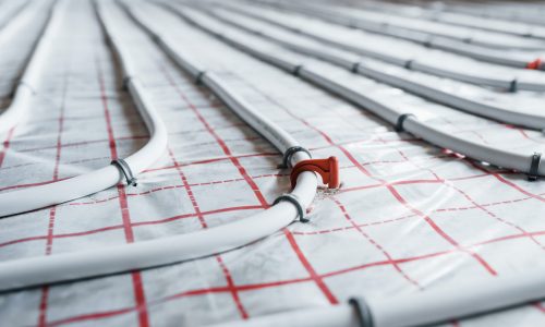 Pipes of underfloor heating system. Close up view. No people.